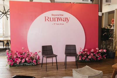 Pink backdrop with a pale circle reading Beyond the Runway by Triple Whale, two chairs and pink flowers