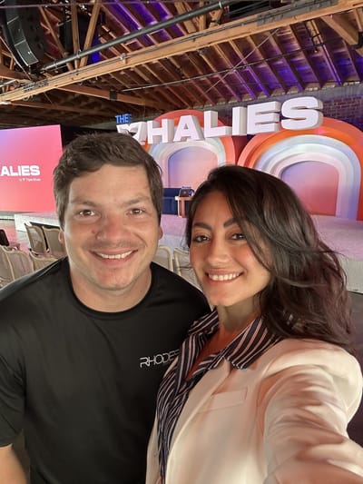 Samantha Pena taking a selfie with a man in front of the stage at The Whalies