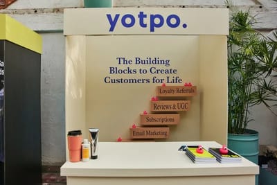 The Yotpo stall built around a stacked building-blocks message