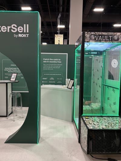 The green LED catch-the-cash machine inside the booth