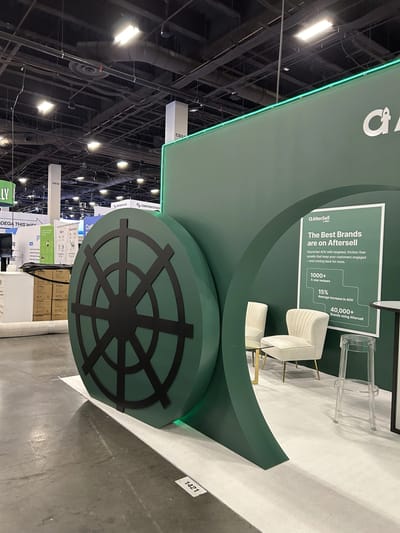 The vault wheel prop standing on the aisle in front of the booth