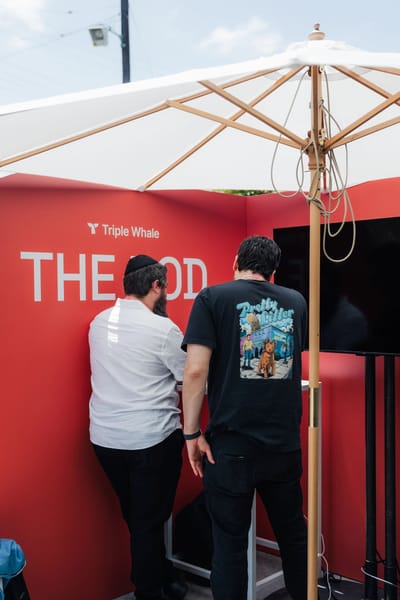 The red Pod with two guests at the counter under a parasol
