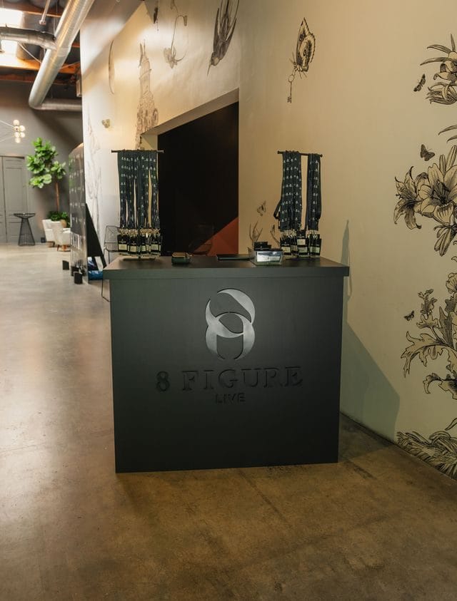 Black 8 Figure Live counter in a hallway