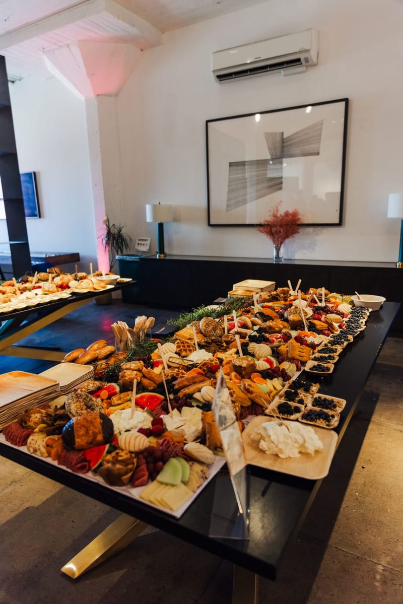 Grazing table of breads, cheeses and fresh fruit