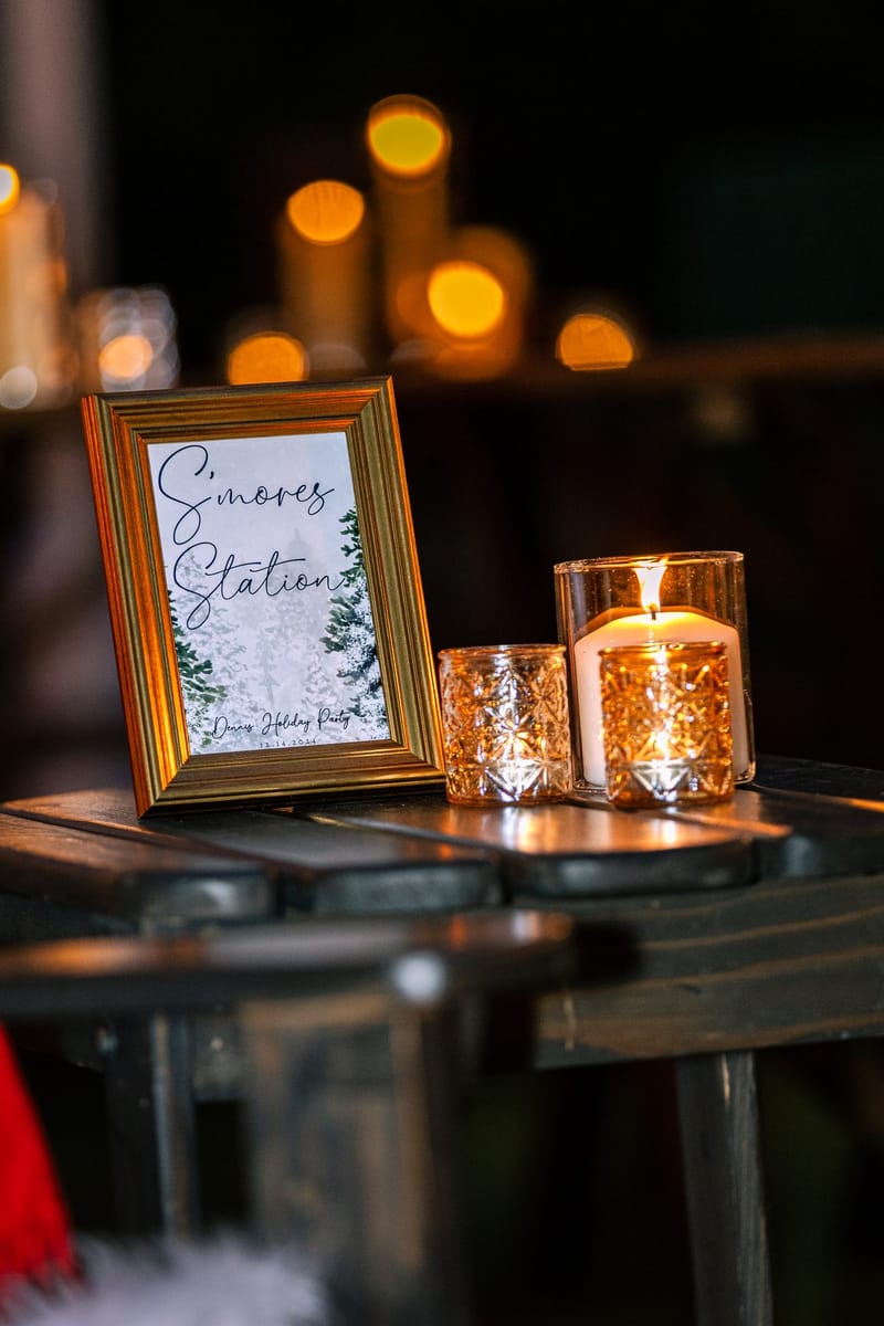 Framed S'mores Station sign beside a mercury glass candle holder