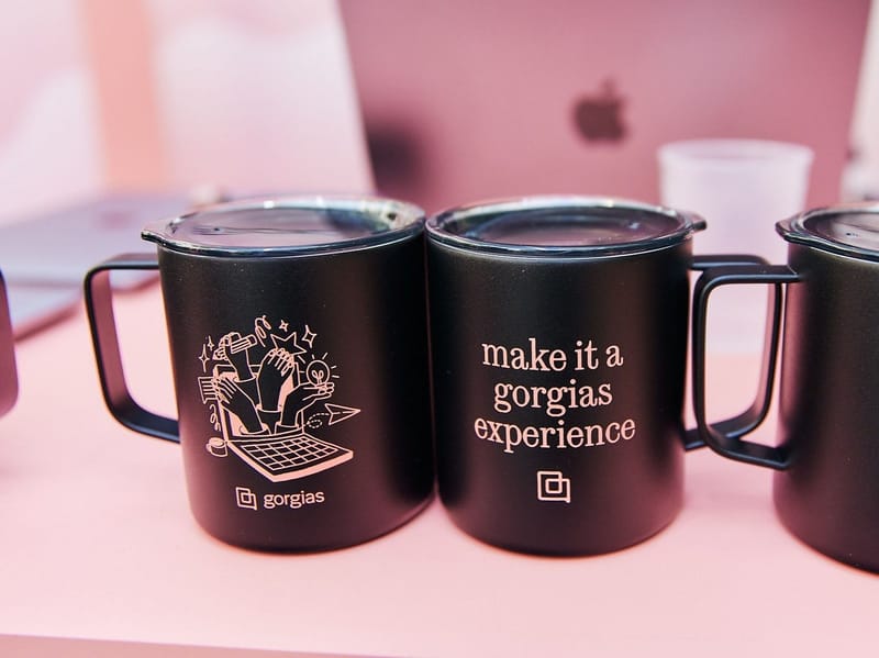 Black camp mugs printed make it a gorgias experience with the Gorgias logo