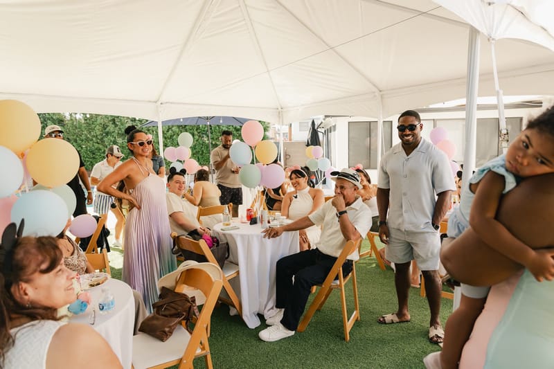 Guests gathered at tables under the white tent