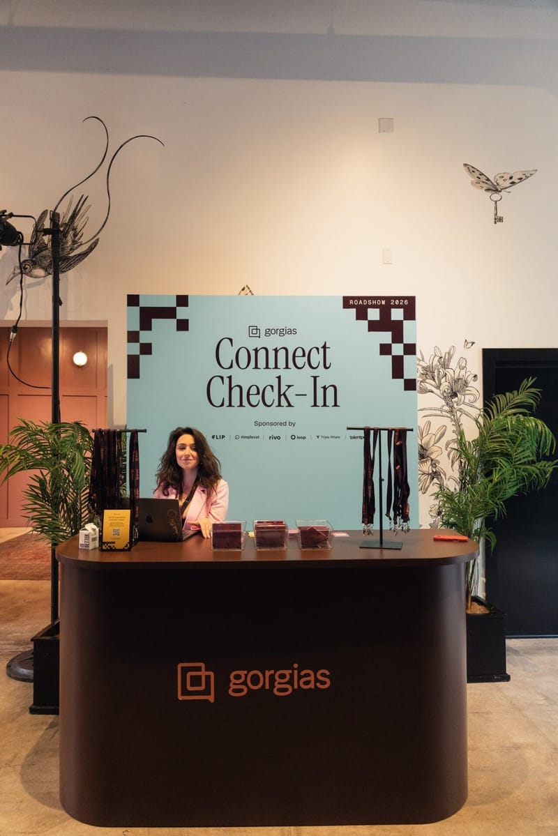 Gorgias Connect check-in desk with a pale blue sign