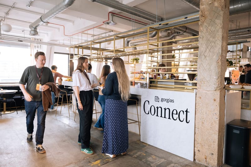 Guests walking past a white Gorgias Connect counter