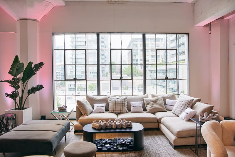 Lounge with a beige sectional sofa beside large windows