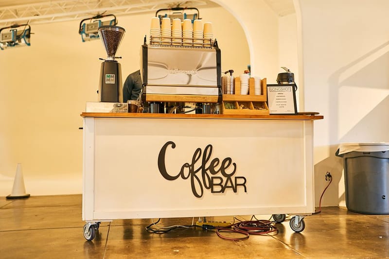 White Coffee BAR cart with an espresso machine, a grinder and a LONGSHOT menu card