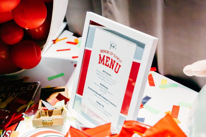 Framed Growing Up Slowly menu listing KFC Bowls, Buckeyes and Buckeye Dip with Graham Crackers