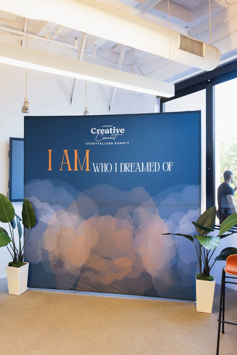 Backdrop reading I AM WHO I DREAMED OF with the Creative Connect logo
