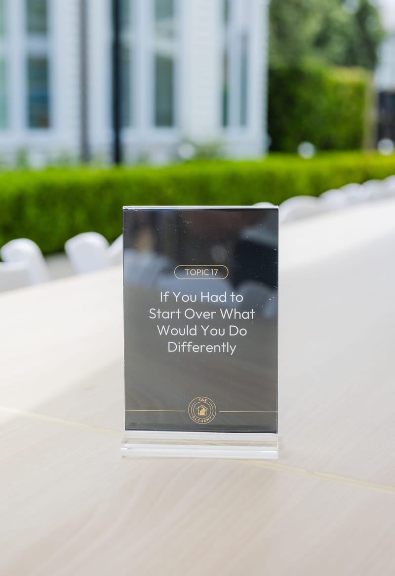 Acrylic table card reading Topic 17, If You Had to Start Over What Would You Do Differently