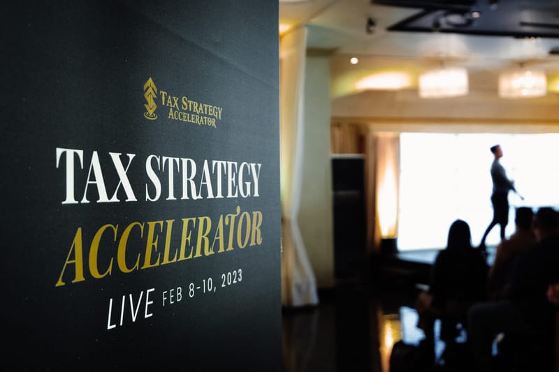 Tax Strategy Accelerator Live Feb 8-10, 2023 banner, with a person silhouetted against a window behind