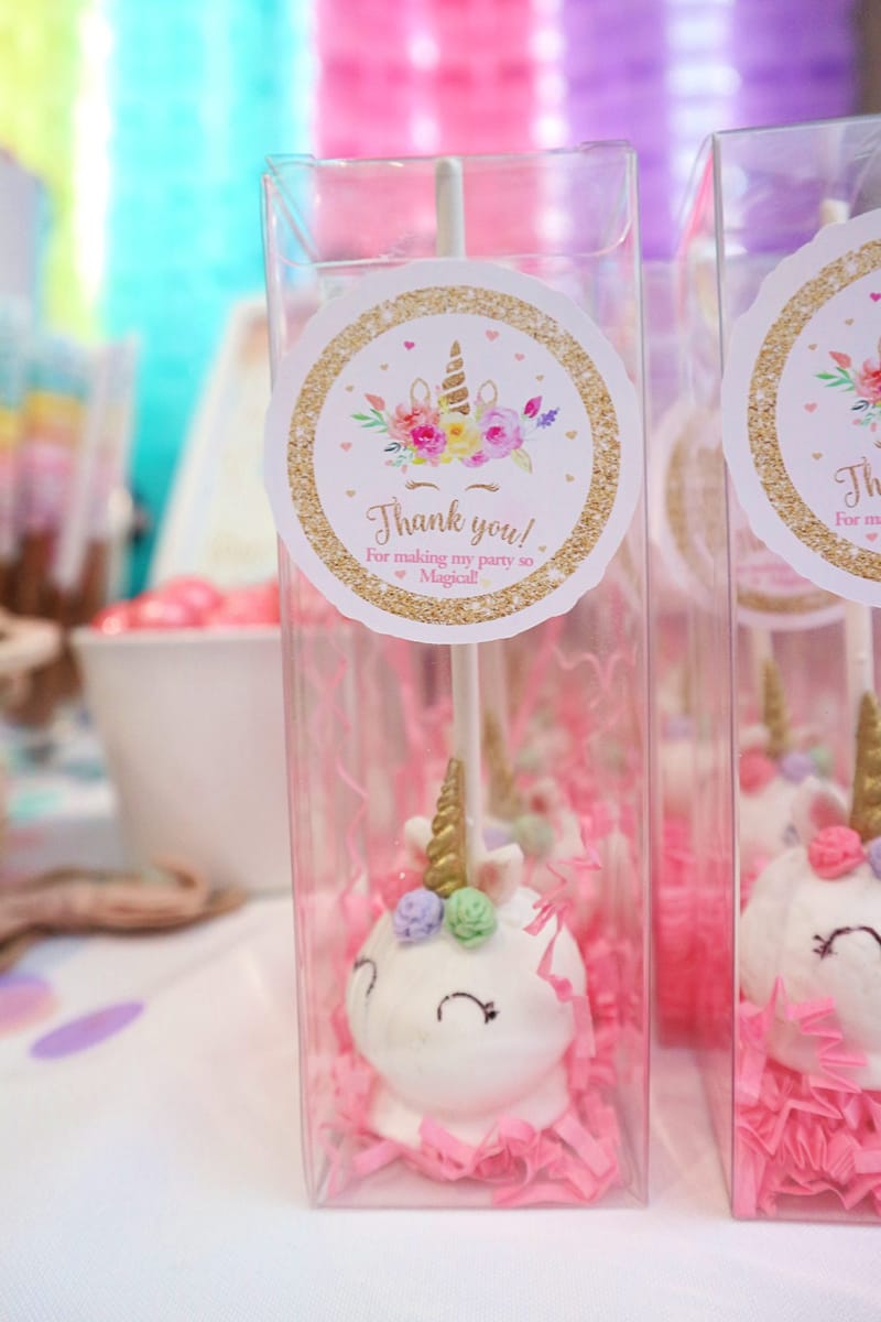 Unicorn cake pops in clear boxes tagged Thank you! For making my party so Magical!